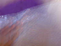 image of blured hands making purple felt with bubble wrap